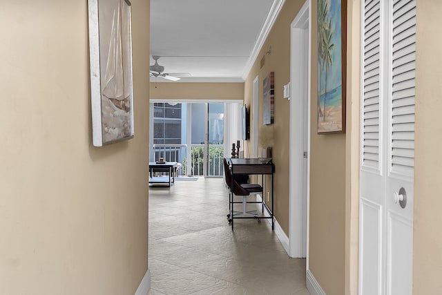 hallway featuring visible vents, baseboards, and ornamental molding
