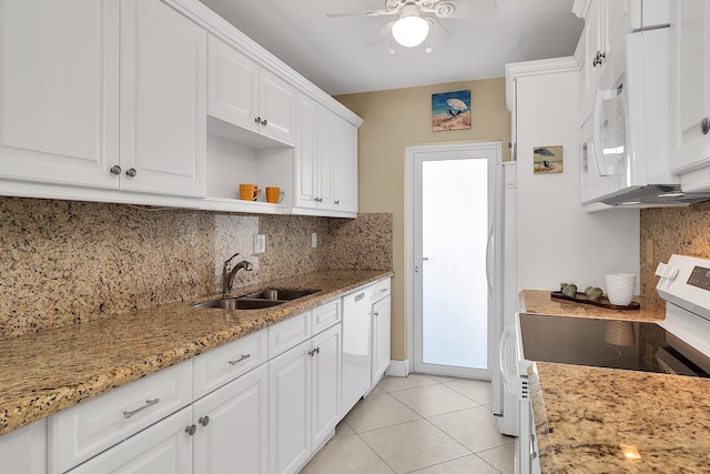 kitchen featuring a sink, white cabinetry, white appliances, light tile patterned floors, and ceiling fan