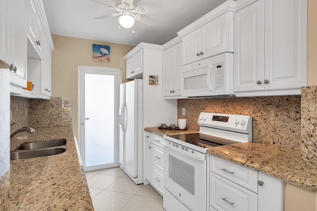 kitchen featuring a sink, white cabinetry, white appliances, light tile patterned floors, and ceiling fan