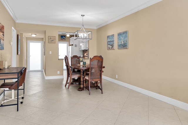 dining room with crown molding, light tile patterned floors, baseboards, and a chandelier