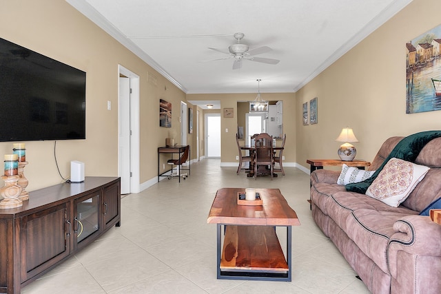 living room with baseboards, ceiling fan, and crown molding