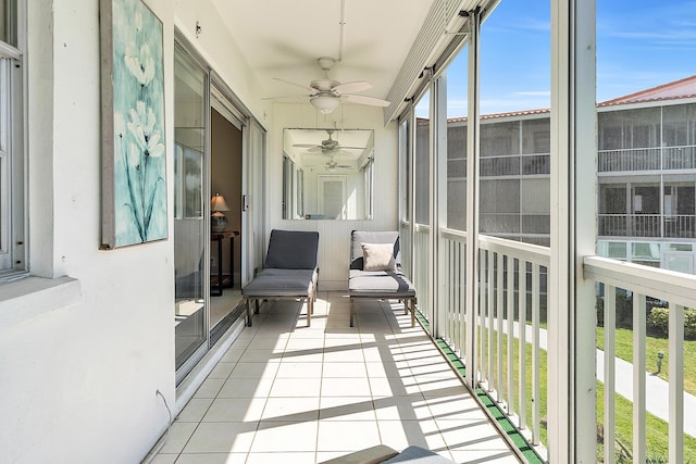 sunroom with a ceiling fan