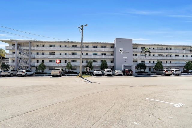 view of property with uncovered parking