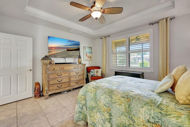 bedroom featuring light tile patterned floors, visible vents, a raised ceiling, a ceiling fan, and ornamental molding