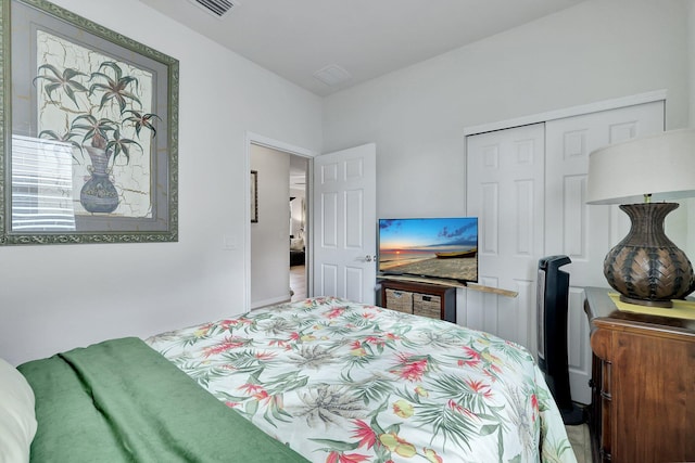 bedroom featuring a closet and visible vents