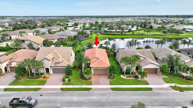 aerial view with a water view and a residential view