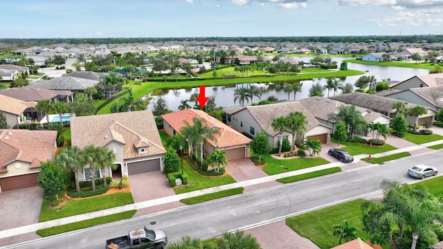 aerial view with a water view and a residential view