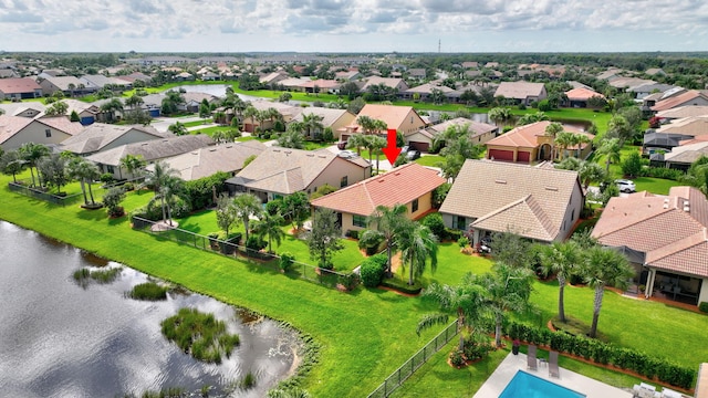 birds eye view of property featuring a residential view and a water view