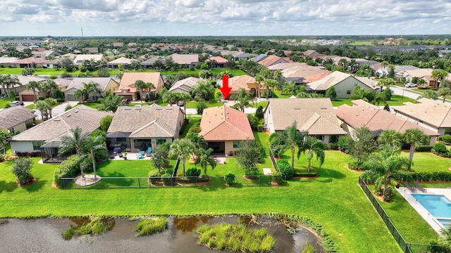 aerial view featuring a water view and a residential view