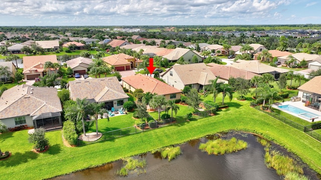 bird's eye view with a residential view and a water view