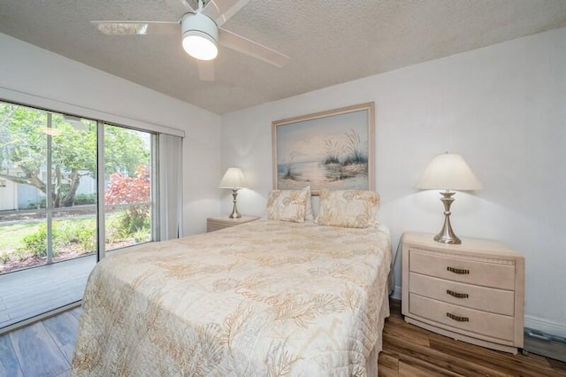 bedroom with a ceiling fan, access to outside, a textured ceiling, and wood finished floors