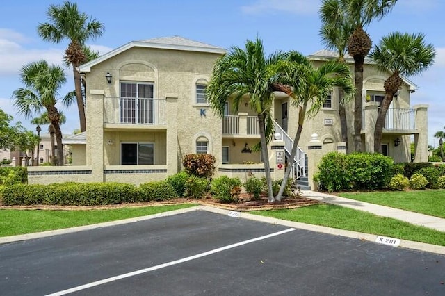 view of property with uncovered parking