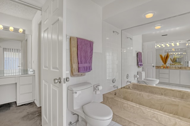 full bath with toilet, a textured ceiling, tile walls, bathing tub / shower combination, and vanity