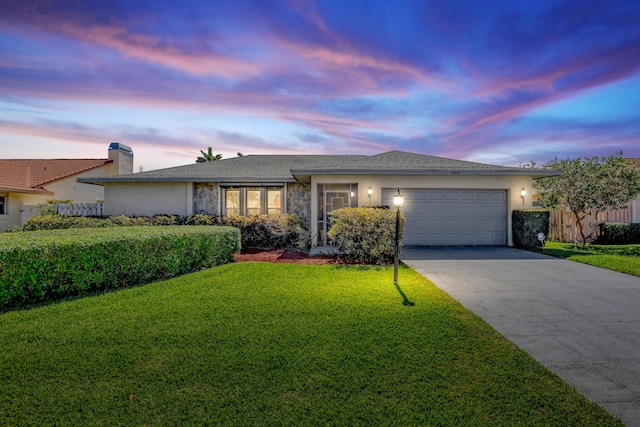 single story home with a garage, fence, driveway, and stucco siding