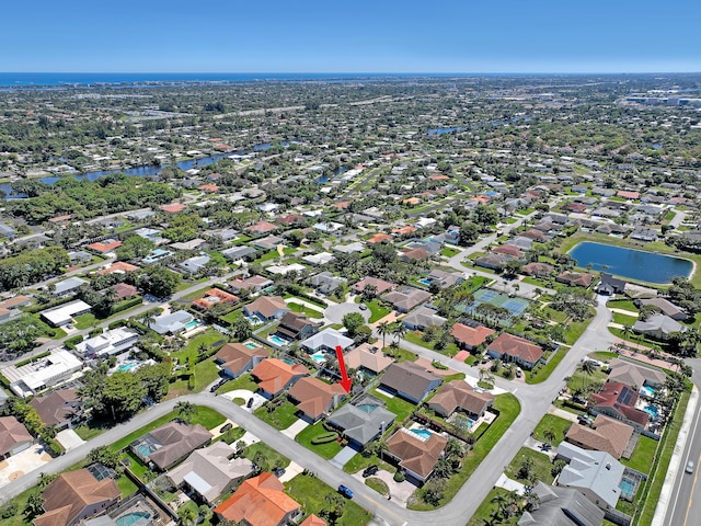 aerial view featuring a residential view and a water view