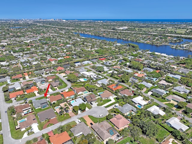 bird's eye view with a residential view and a water view