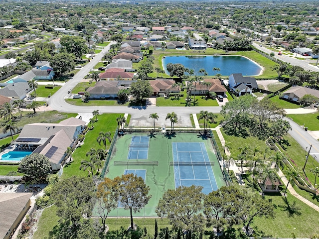 birds eye view of property with a residential view and a water view