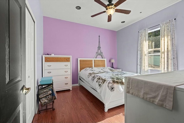 bedroom featuring ceiling fan and wood finished floors