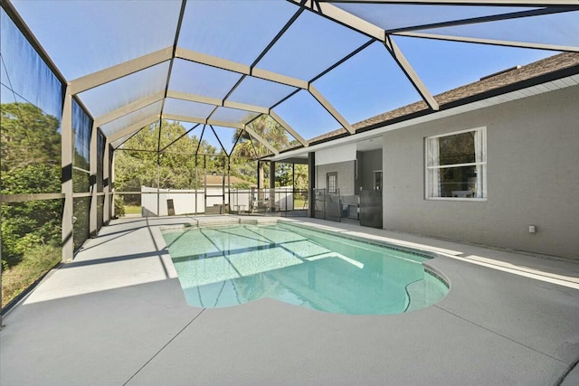 pool with a patio area and a lanai