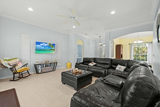 living area featuring arched walkways, light tile patterned floors, ornamental molding, and recessed lighting