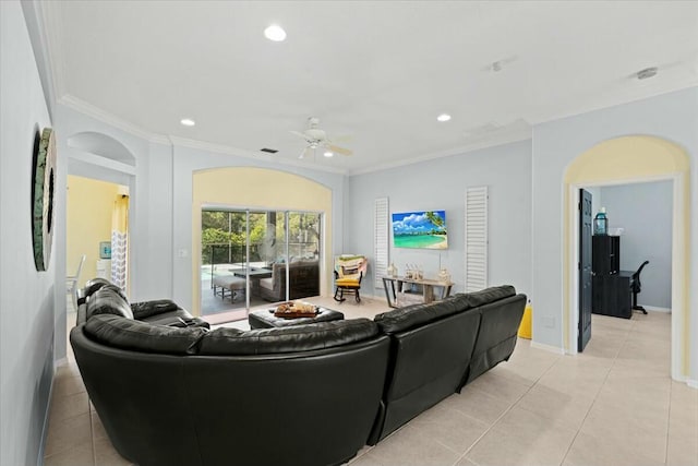 living room featuring light tile patterned floors, baseboards, ornamental molding, and recessed lighting