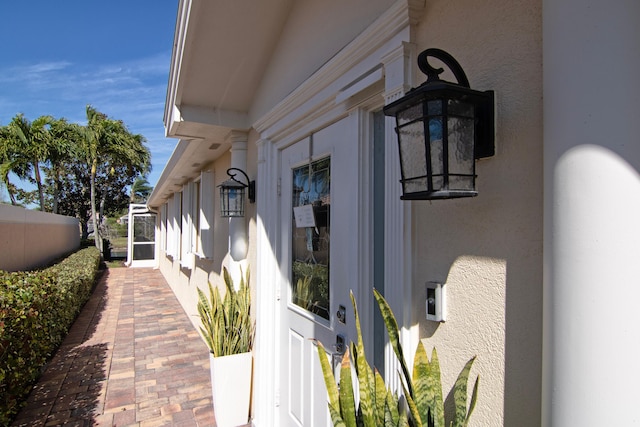 exterior space featuring fence and stucco siding