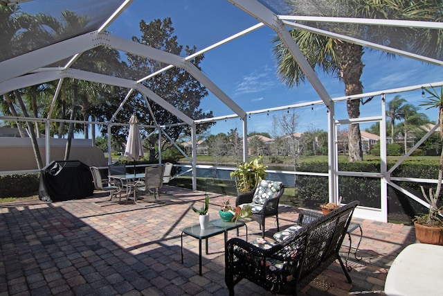 view of patio with a lanai