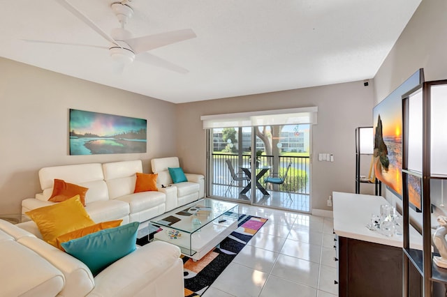 living room featuring light tile patterned floors and ceiling fan