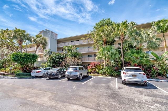 view of property featuring uncovered parking