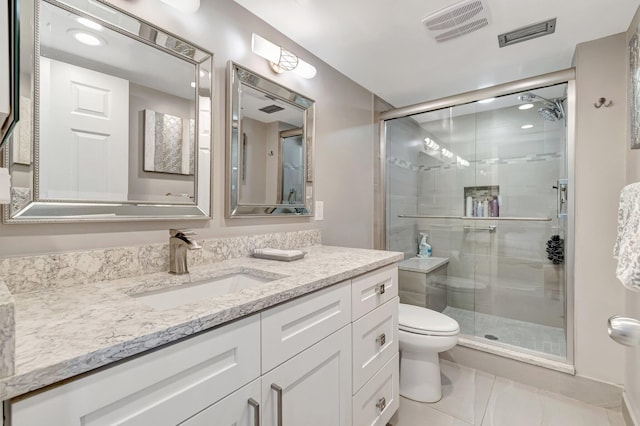 full bath featuring visible vents, toilet, a stall shower, vanity, and tile patterned floors