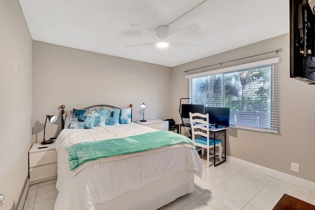 bedroom featuring ceiling fan, baseboards, and light tile patterned flooring