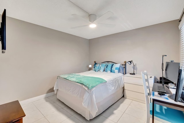 bedroom featuring light tile patterned floors, ceiling fan, and baseboards