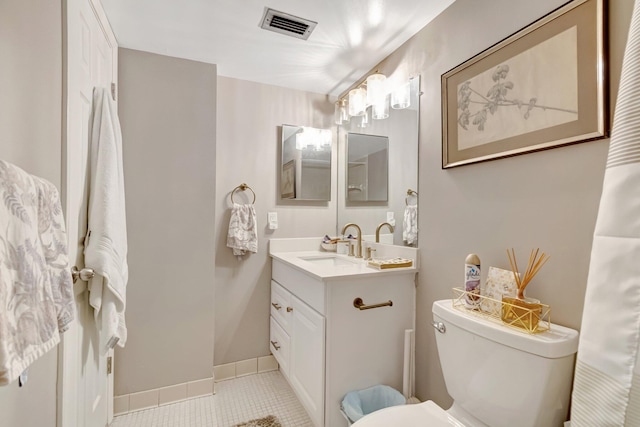 bathroom featuring baseboards, visible vents, toilet, tile patterned floors, and vanity