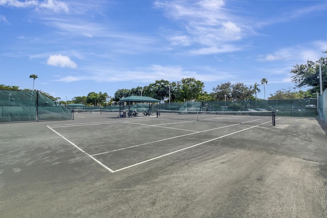 view of sport court featuring fence