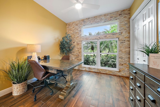 office featuring dark wood-type flooring, vaulted ceiling, and a ceiling fan