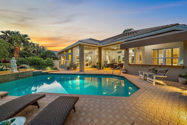 view of swimming pool featuring a patio area and a fenced in pool