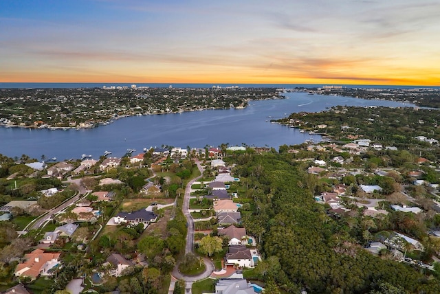 aerial view with a water view and a residential view