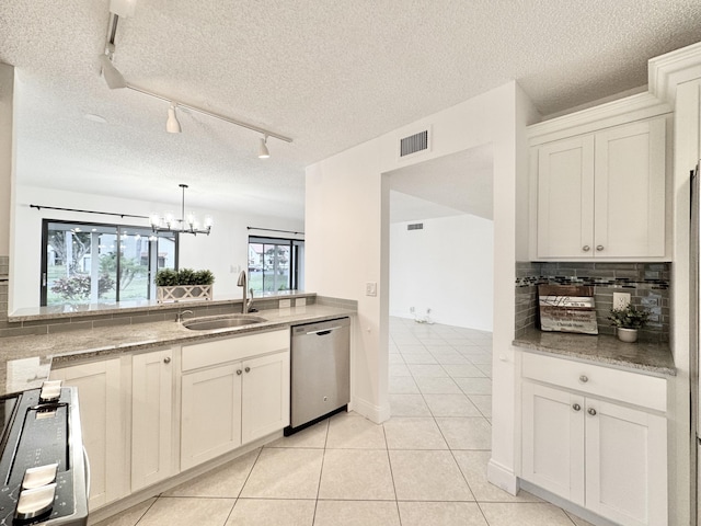 kitchen featuring tasteful backsplash, visible vents, stove, stainless steel dishwasher, and a sink