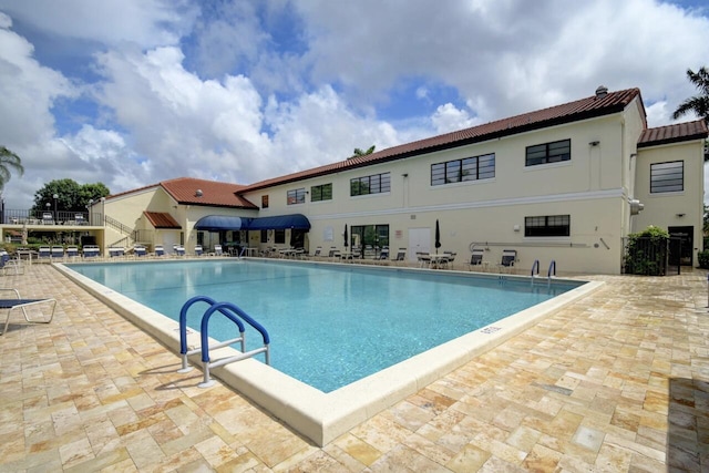 community pool with a patio