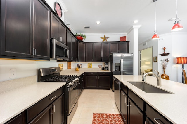 kitchen with visible vents, crown molding, appliances with stainless steel finishes, light tile patterned flooring, and a sink