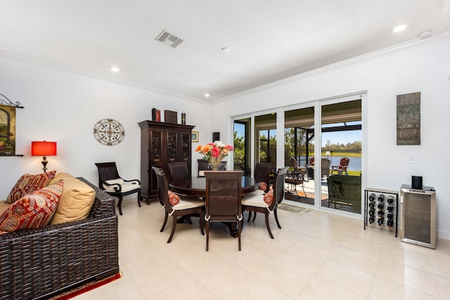 dining area with recessed lighting, visible vents, and ornamental molding