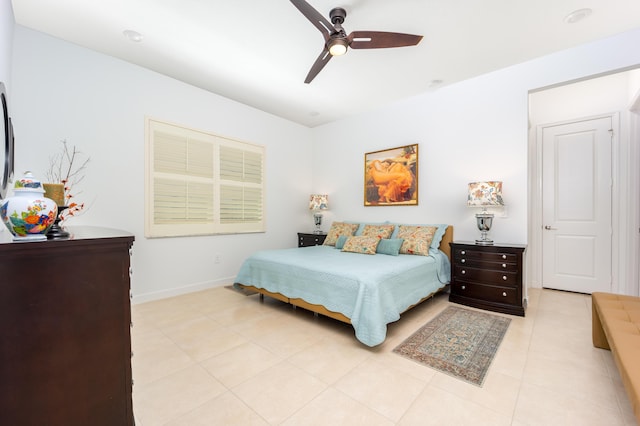 bedroom featuring light tile patterned flooring, baseboards, and ceiling fan