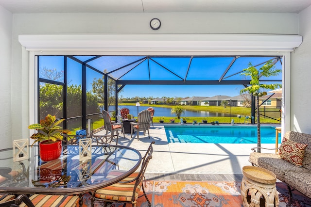 pool featuring a water view, a lanai, and a patio area