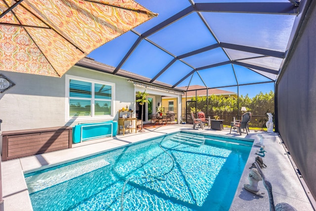 view of pool with a lanai, a patio area, and a fenced in pool