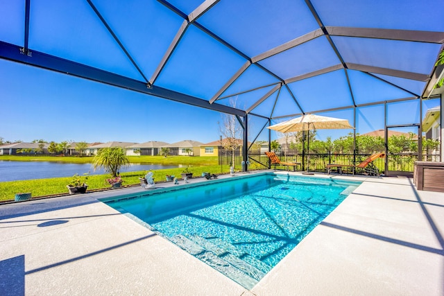 pool featuring a lanai, a patio area, and a water view