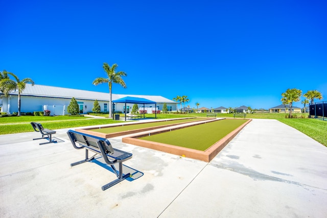 view of community with a yard and a residential view