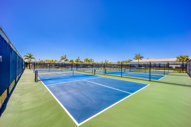 view of sport court with fence