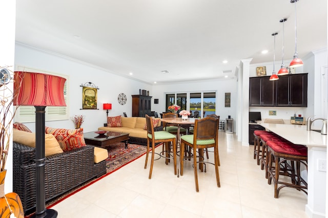 dining area with recessed lighting and crown molding