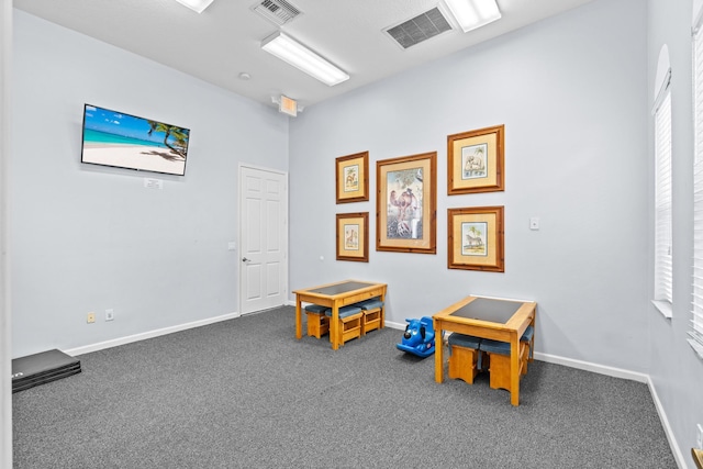 playroom featuring baseboards, visible vents, and carpet flooring