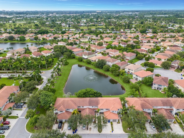 bird's eye view featuring a water view and a residential view